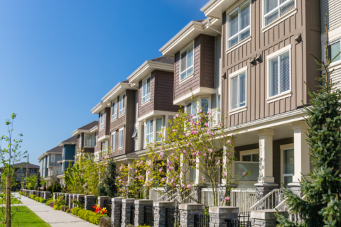 Photo of row of townhouses on a sunny day