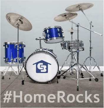 Blue drum set with CB logo on drum with hashtah #HomeRocks written underneath