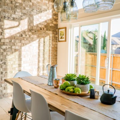 sun soaked morning room with dining table made of wood