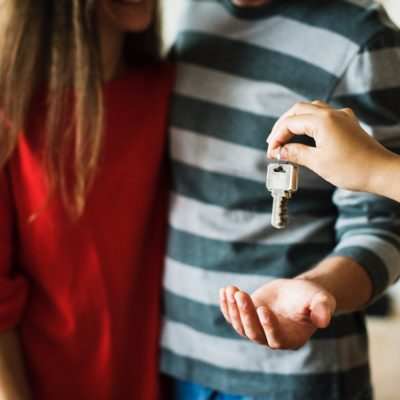 couple being haded a key