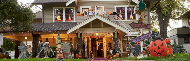 house with lots of halloween decorations outside