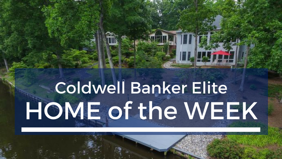house with trees with text overtop saying "Coldwell Banker Elite Home of the WEEK"